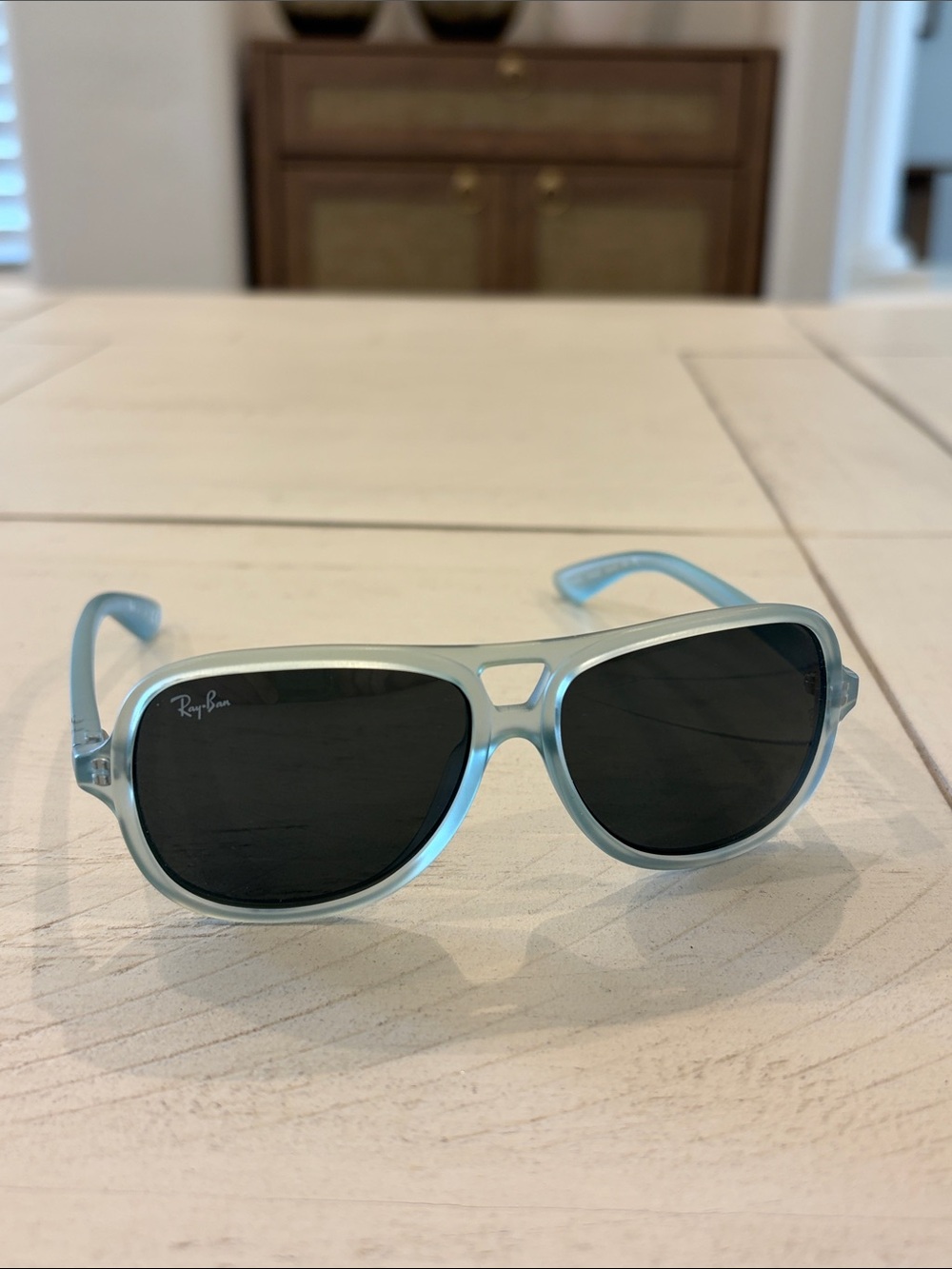 Ray-Ban kidsTranslucent Light Blue Frame Sunglasses with Black Lenses